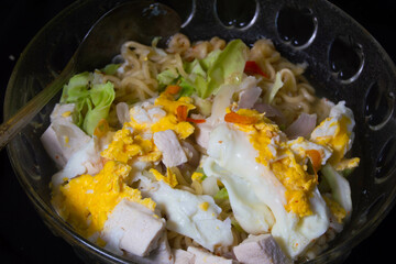instant noodle soup with egg and tofu topping
