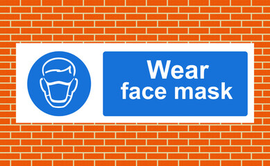 Obraz premium Face masks must be worn sign on a wall