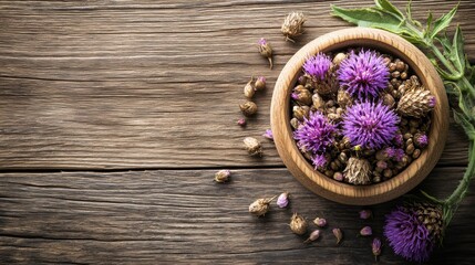 Fototapeta premium milk thistle seeds and flowers in close-up on wooden background, promoting herbal remedy concept with banner design