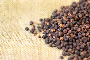 black pepper scattered on a brown background