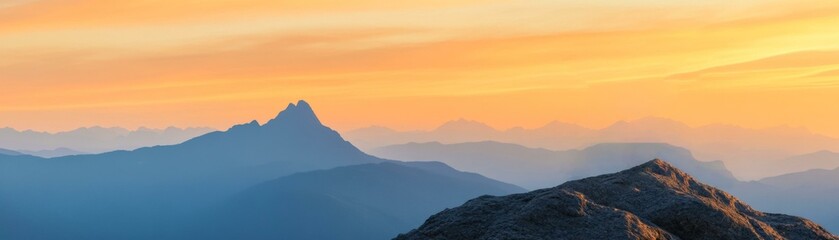 Fototapeta premium Majestic mountains under a colorful sunset sky, showcasing serene beauty and natural tranquility.