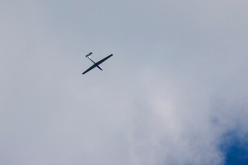 an Glider in the sky during the day