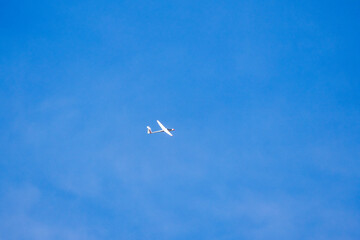 an Glider in the sky during the day