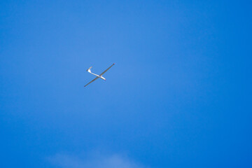 an Glider in the sky during the day