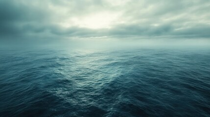 Obraz premium A Vast, Grey-Skied Ocean Under a Hazy Sky