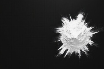 White flour pile on a dark background with a soft texture.