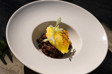 A delightful combination of zesty lemon sorbet served on rich chocolate cake. This dessert offers a perfect balance of flavors, making it an ideal treat for any occasion.