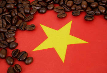 Roasted coffee beans on flag of Vietnam. Vietnamese coffee concept.