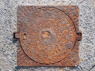 Rounded pattern of metal grunge texture with relief and oxide.