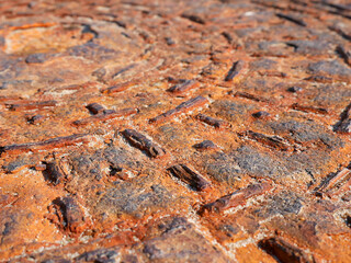 Rounded pattern of metal grunge texture with relief and oxide.