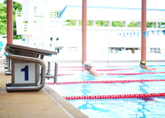 Obraz premium The starting platform for swimming competitions,number 1. During non-competition times,swimmers practice to keep their bodies fit.