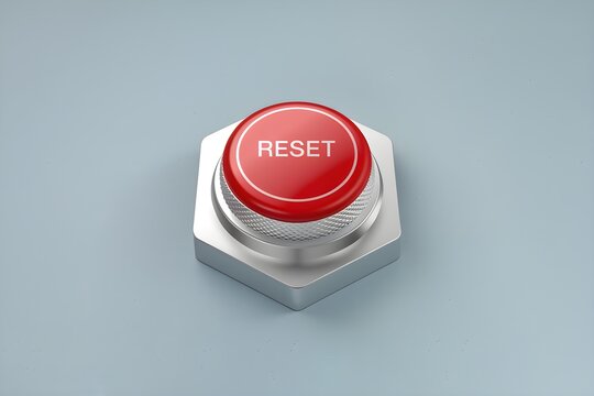 Red RESET button on silver base, light blue background suggests electronic interface