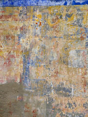 Old wall texture - rusty wall. Grunge background. Several layers of paint.