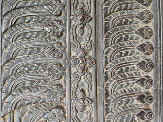 Detail close up of a thai sculpture pattern made of metallic iron