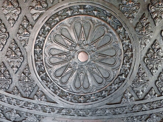 Detail close up of a thai sculpture pattern made of metallic iron