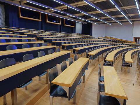 06-09-2024 Zurich, Switzerland. University of Zurich (UZH) Zentrum building. Lecture hall interior shot, wide angle view, empty chairs, no people