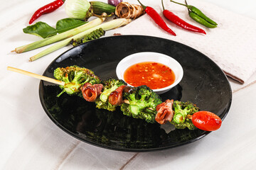 Thai Street foof satay with bacon and broccoli