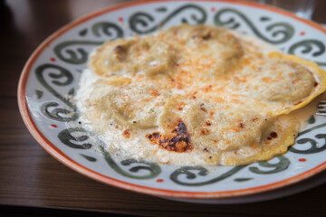 Italian plate of pasta served on restaurant. Classic italian cuisine dish. Popular italian food.