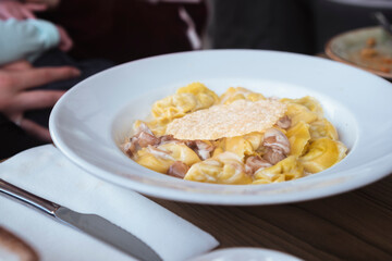 Italian plate of pasta served on restaurant. Classic italian cuisine dish. Popular italian food.