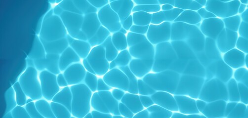 Obraz premium This image captures a serene underwater scene with a vibrant blue water surface, featuring small, white ripples and a sunlit edge, creating a tranquil and peaceful atmosphere