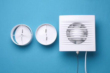 Ventilation hood fan on a blue background.