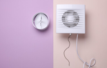 Ventilation hood fan on pastel background.