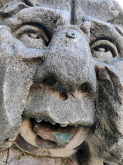 Head detail of the ancient man sculpture.