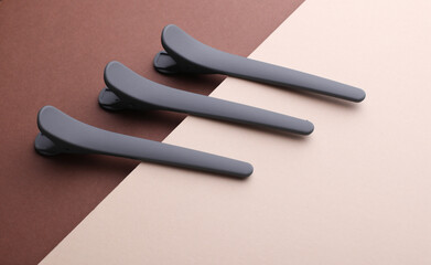 Plastic clothespins on a brown beige background