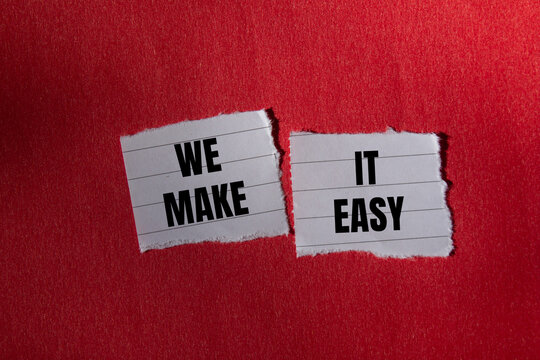 We make it easy message written on ripped torn paper piece with red background. Conceptual we make it easy symbol. Copy space.
