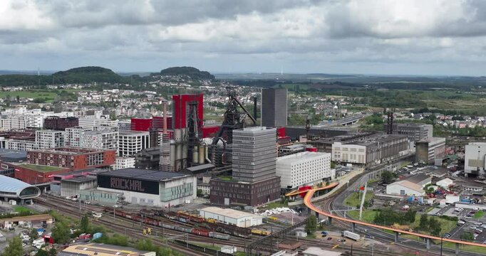 Esch Belval, old blast furnace turned into modern living urban area in Luxemburg. Aerial drone overview video