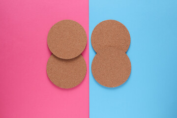 Cork coasters for drinks on a pink blue background