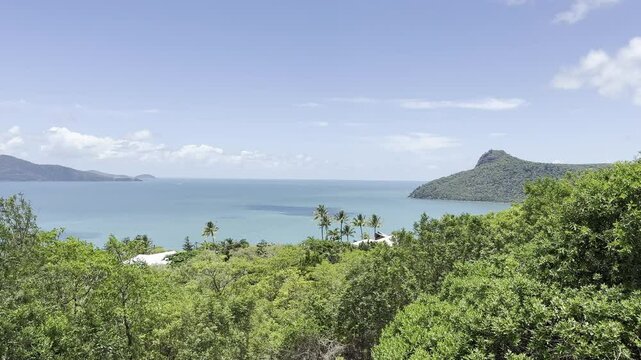 Hamilton tropical island, Whitsundays overlooking coast to right of bay with peninsula nob