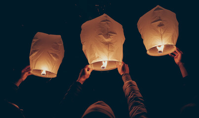 Glowing paper lanterns float into night sky during festive gathering, symbolizing hope and unity, as people release them in warm, communal celebration