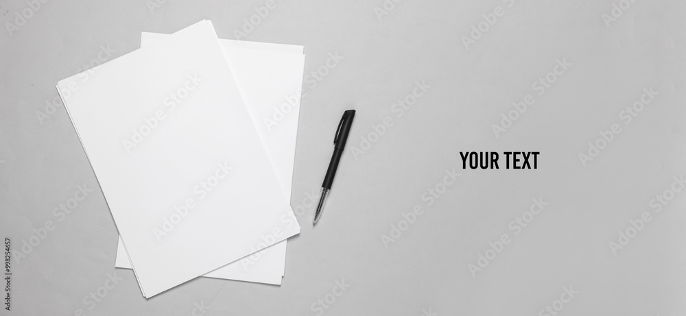 Aufkleber white blank sheets of a4 paper size or documents mockup with pen on a gray background. template for 