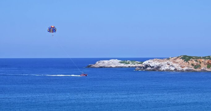 Parasailing over the bay Bali isle of Crete. Greece, Mediterranian sea