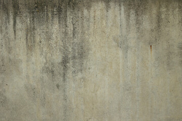 Texture of an old concrete wall with streaks of dirt