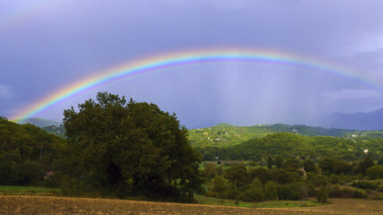 rainbow in a wide rural landscape