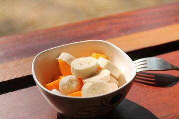 Morning healthy breakfast Banana and papaya cut in peaces. 