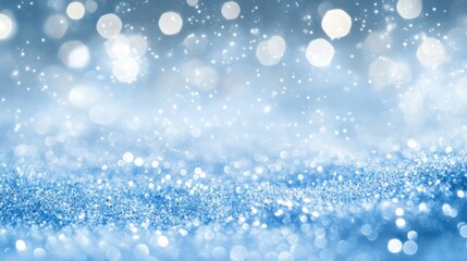 Festive blue backdrop adorned with shimmering silver glitter lights Blurred winter snow abstraction