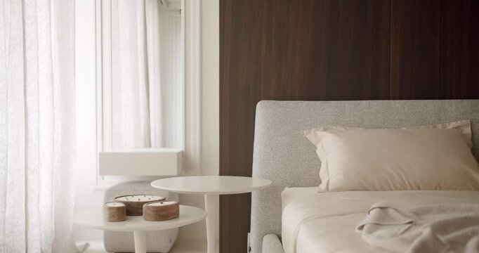 A cozy minimalist bedroom featuring modern decor with soft neutral colors, a comfortable bed, and elegant bedside tables. Perfect for creating a serene and restful atmosphere. Cozy Bedroom Interior