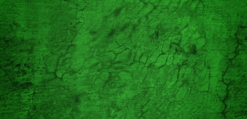 the long wall background is green, blank uncoated canvas or scrim for background long and wide panoramic banner background from rough linen dark green cloth or burlap