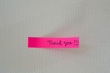 a note on the wall that says thank you