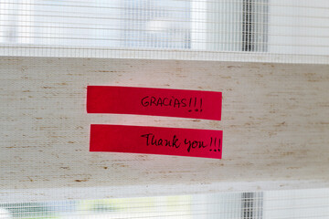 a note on the wall that says thank you