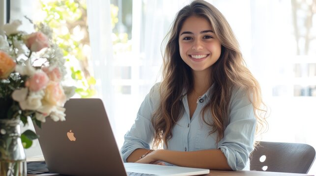 Smiling Woman Working on Laptop