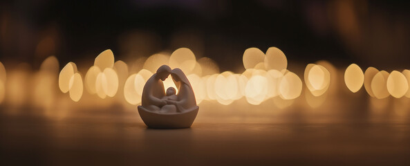 Minimalistic Christmas background. Nativity scene: newborn baby Jesus Christ in the manger, Mary, Joseph.