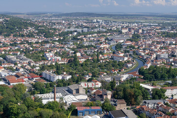 Obraz premium Nancy, France - September 21th 2024 : View Nancy metropolis seen from the 16th floor of the Panoramic Tower with the Marne-Rhine canal winding through the middle of the city.