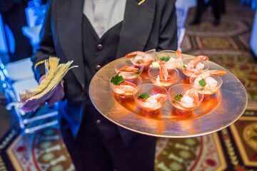 waiter serving food in restaurant