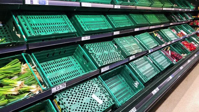 London, England, September 19th 2024: Empty fruit and vegetable baskets in Tesco, Bishopsgate branch. Shortage of food, supply chain and disruption. Cost of Living. Static shot.	
