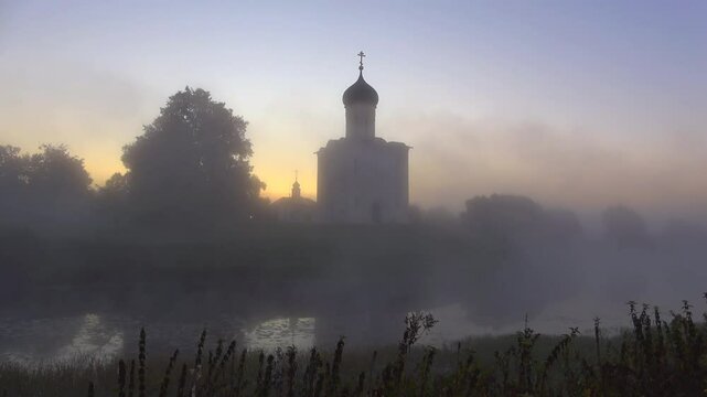 The medieval Church of the Intercession on the Nerl in the fog in the early morning. Bogolyubovo, Russia