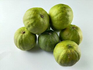 Sweet green lemons with white background